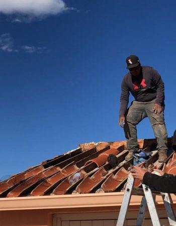 working on a tile roof on a Tucson home